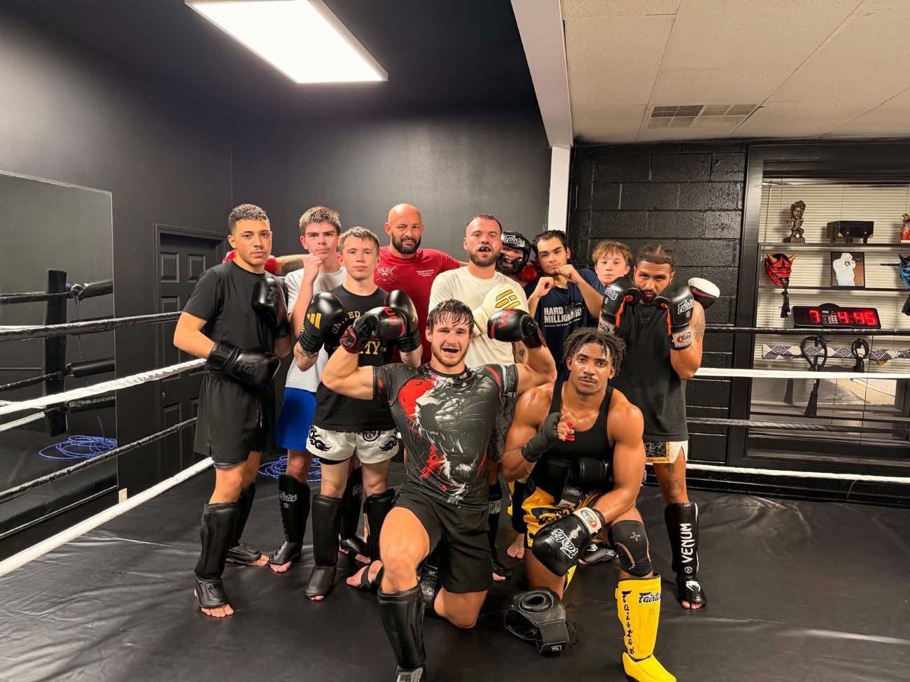 TJ Gentry with his Asylum Martial Arts teammates in the gym